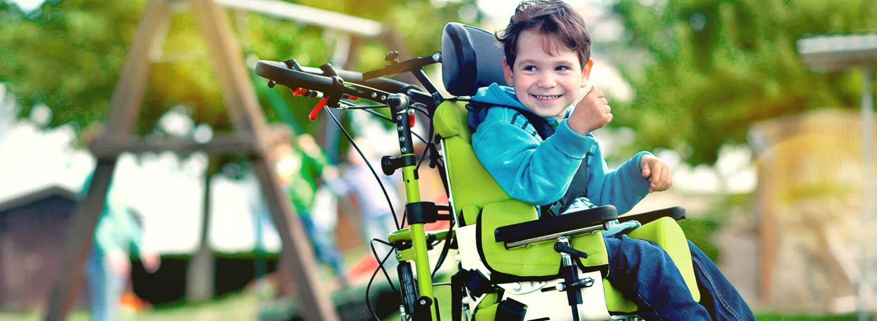 Child sitting in a powered wheelchair
